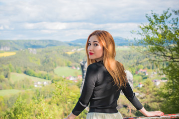 Fototapeta na wymiar Tourism concept, pretty romantic woman look at beautiful view in mountains , Vacation in Saxon Switzerland 