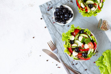 Appetizing greek salad in a plate on a served table