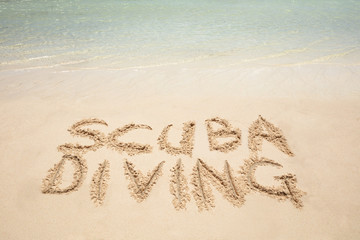 Scuba Diving Text Written On Sandy Beach
