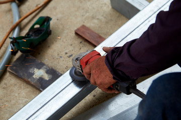Hand Electric wheel grinding on steel