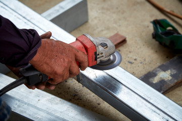 Hand Electric wheel grinding on steel