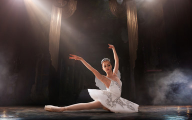 Ballet. Classical ballet performed by a couple of ballet dancers on the stage of the opera house.
