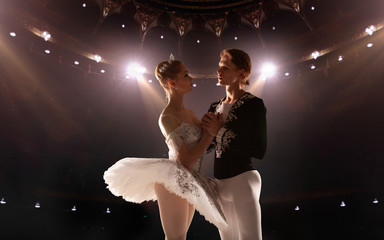 Ballet. Classical ballet performed by a couple of ballet dancers on the stage of the opera house. © Artur Didyk