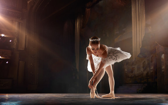 Ballet. Classical ballet performed by a couple of ballet dancers on the stage of the opera house.