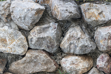 Rock and stone seamless pattern with gray smooth cobbles.