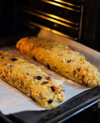 christmas stollen dough on baking tray in oven