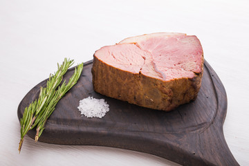 Food, meat and delicious concept - Close up of horse meat with salt on a cutting board