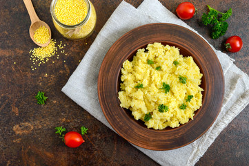 Useful millet porridge in a clay bowl. Lenten menu. Vegan Dishes