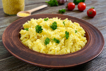 Useful millet porridge in a clay bowl. Lenten menu. Vegan Dishes