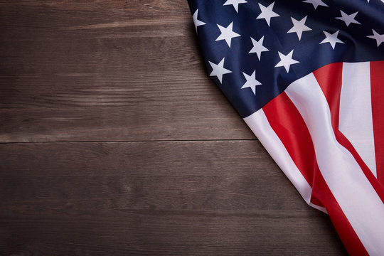 American flag on wooden background with copy space. 