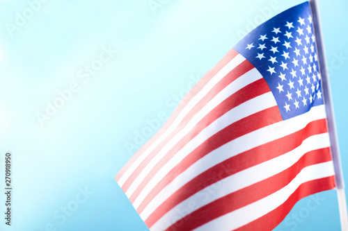 American flag on blue background with copy space.