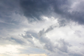 dramatic dark rainy cumulus clouds background