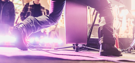 Rockabilly night. View from the back of the stage of a unrecognizable double bass player with...