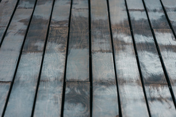 Background of woods arranged on aged tables of muted tones.
