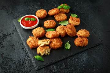 Fried Mac, macaroni and Cheese Bites in breadcrumbs with ketchup sauce