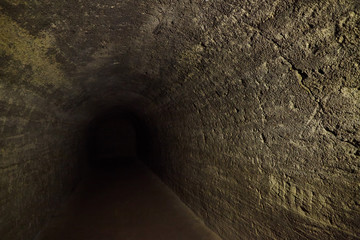 Ancient stone dungeon under the castle or an ancient building from the middle ages.