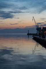 Fototapeta na wymiar A pier in Thessaloniki, Greece with a an old crane