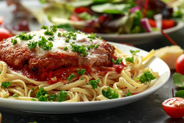 Chicken Parmesan with Cheese and Marinara Sauce served over spaghetti, pasta