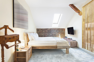 Luxurious modern loft bedroom interior with twin bed