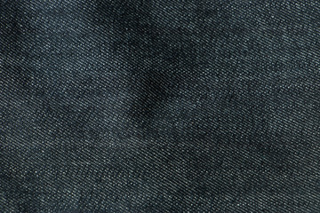 Fototapeta na wymiar Black jeans fabrics background, The Close up black jeans texture.