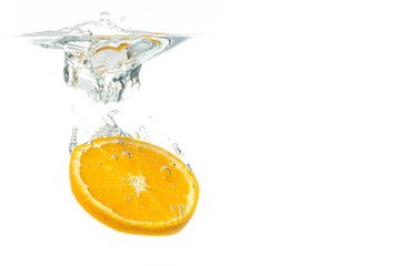 Orange fruit slice in water splash