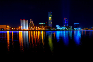 Naklejka premium Cityscape of Yekaterinburg, Russia at night with lights reflections on water