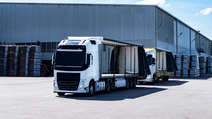 Cargo truck at warehouse building . 