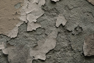 old white wall with cracked plaster and paint