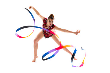 Girl doing rhythmic gymnastics with ribbon .