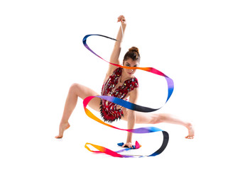 Girl doing rhythmic gymnastics with ribbon .