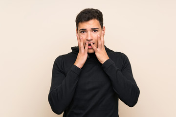 Handsome man over isolated background with surprise facial expression