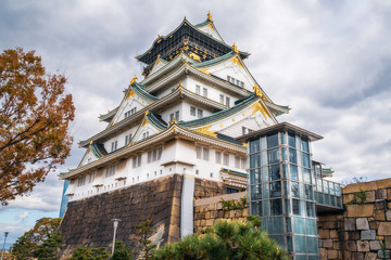 Looking up at Osaka Castle, one of the most famous historical landmarks in Japan. The modern glazed entry was build to help people with disabilities to be able to visit the castle close up.