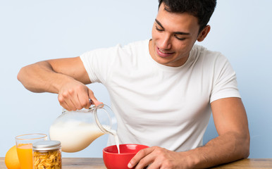 Handsome man in having breakfast