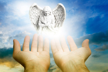 guardian angel archangel with hands over divine sky