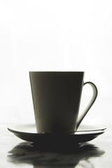 Front view of a delicious and tasty cup of freshly made coffee