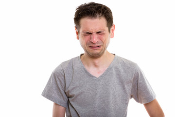 Obraz premium Studio shot of sad young man crying