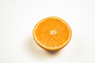 half an orange on white background, Isolated photo.