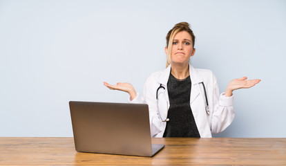 Blonde doctor woman having doubts while raising hands