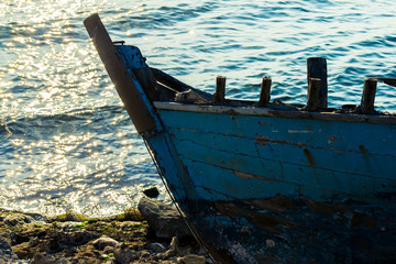 A fishing boat moored on the beach