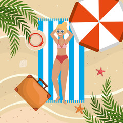 woman wearing swimsuit and taking sun in the towel