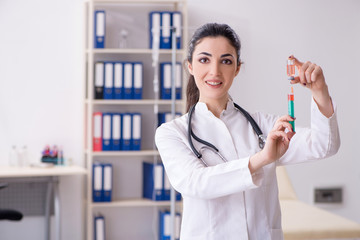Young female doctor in infusion concept 