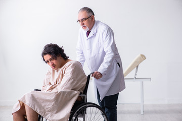 Fototapeta premium Old male doctor psychiatrist and patient in wheel-chair 