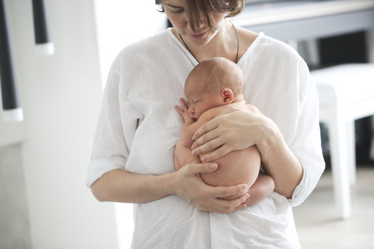 Mom And Baby, Newborn Sleeping In Mother Hands