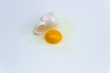 Broken egg isolated on white background.
