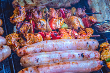 Bratwurst with shashlik and bacon on the grill