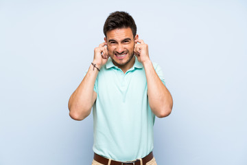 Handsome young man over isolated background frustrated and covering ears