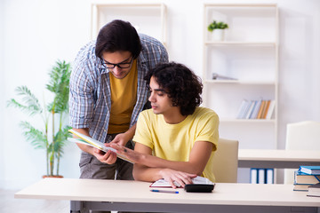 Two male students in the classroom