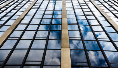  reflection of clouds in the windows on the high tower