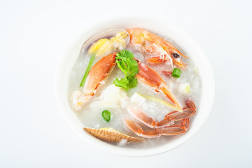 A bowl of nutritious and delicious seafood porridge on a white background