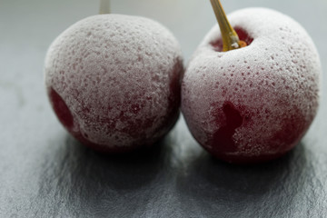 Group Of Frozen Cherries on a dark background Close Up. 